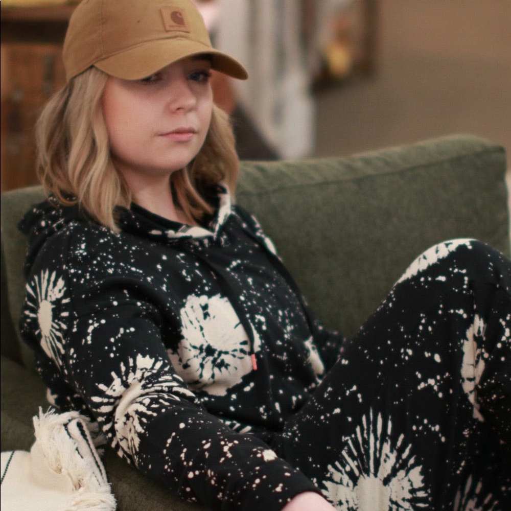 A stormy pattern pullover with a bleached tie dye effect. NWT never worn.